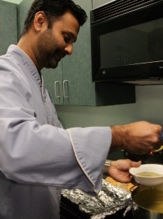 Hari Pulapaka preparing broccoli soup of local produce