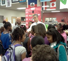 Arne Duncan and rapper Common at Memorial Middle School